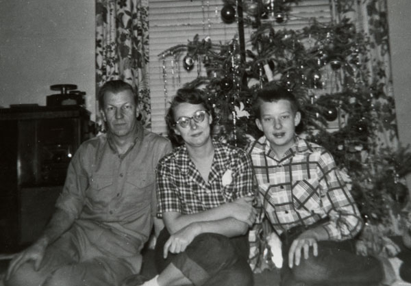 With Mom and Dad, age 12.